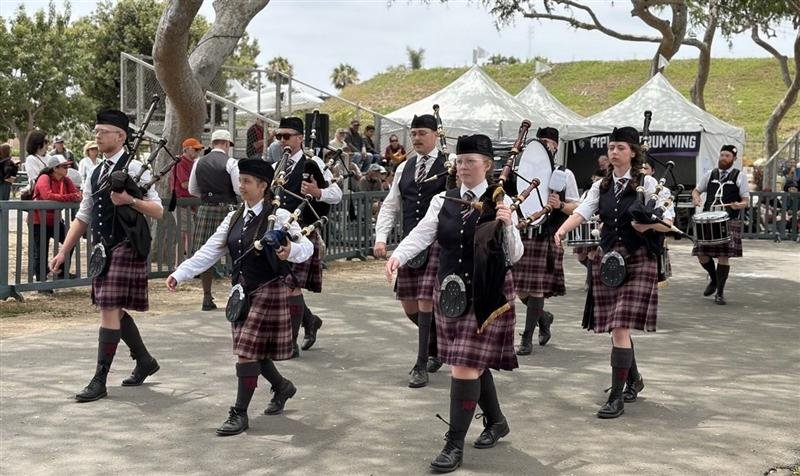The band marching onto the field at Scottish Fest